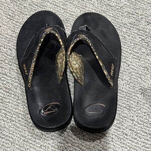 Reef Black and Gold Patterned Sandals